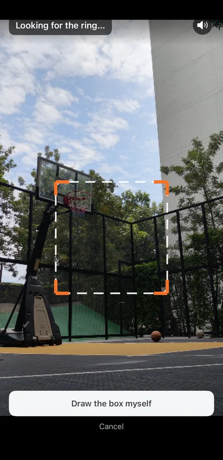 The app looking for the ring, with an orange box locking onto the hoop by itself.